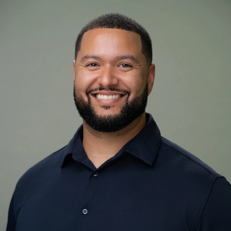Ben Havens-Stokes, founder of Ori PM Consulting, smiling in a navy shirt